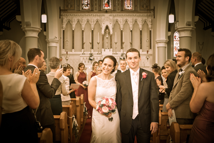bride and groom walking down aisle